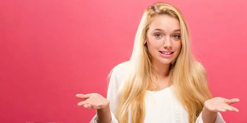Young woman shrugging
